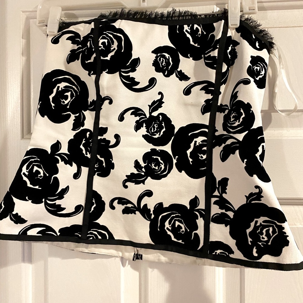 A fitted bodice top worn with black dress pants for events or date nights out.